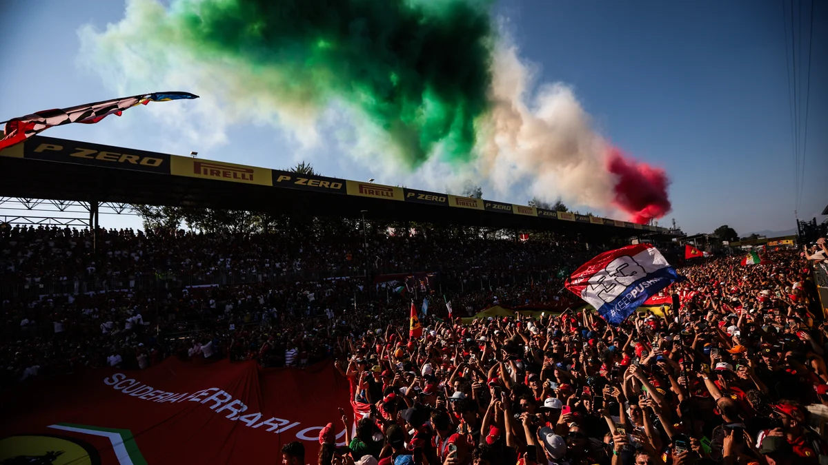 Tifosi fill the grandstand at Monza under Italian flag smoke