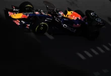 Max Verstappen in the Red Bull RB22 in light and shadow on the Baku City Circuit, Azerbaijan Grand Prix 2026