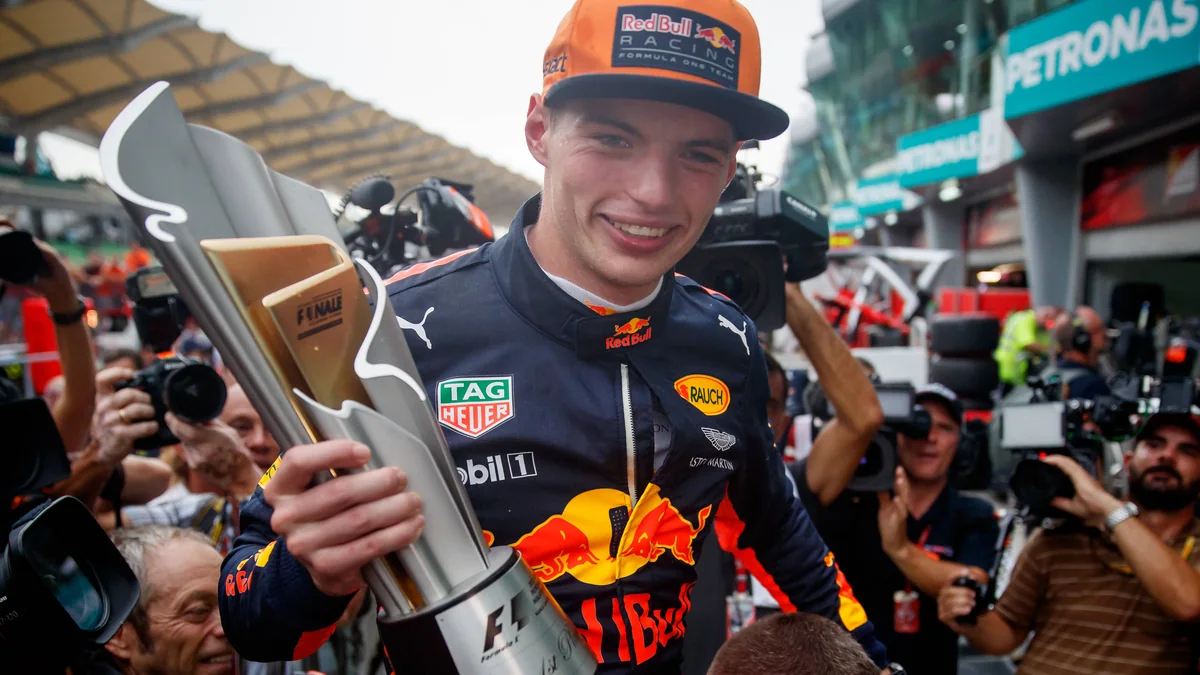 Max Verstappen holds the winner's trophy after the 2017 Malaysian Grand Prix at Sepang