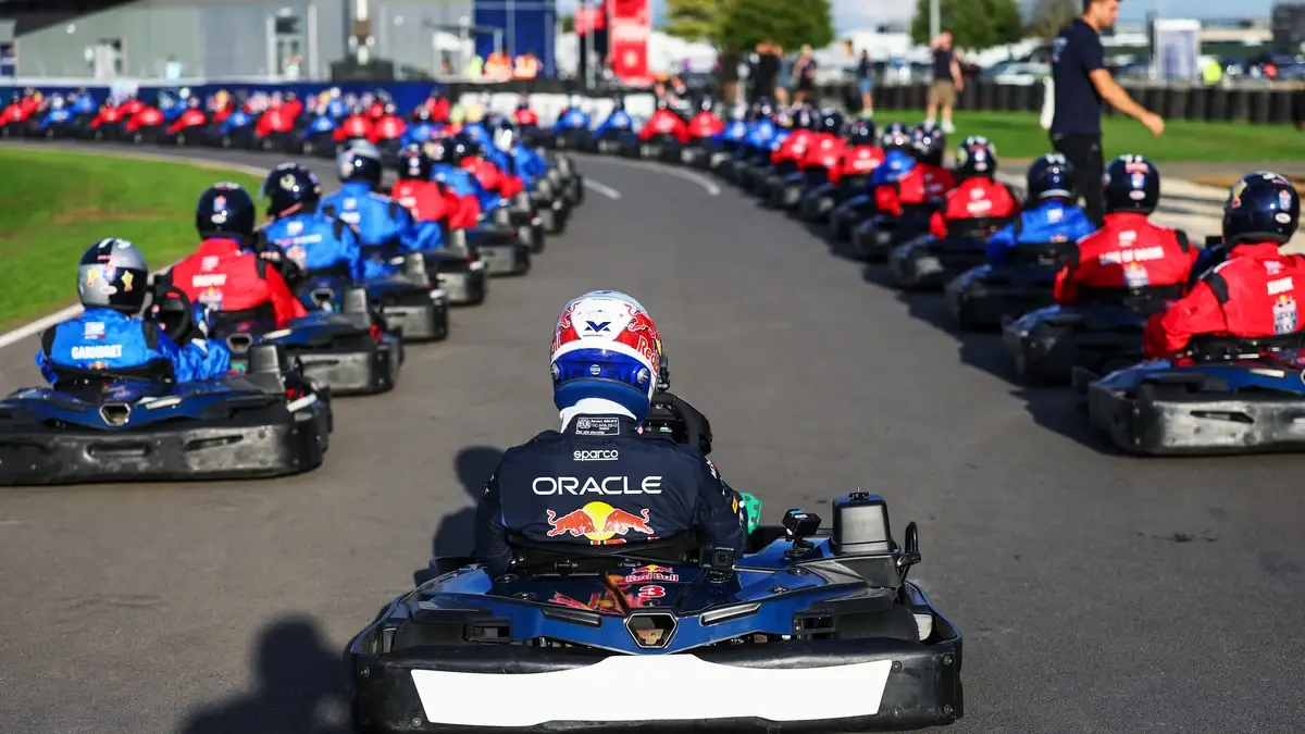 Max Verstappen at the back of the grid of one hundred karts.