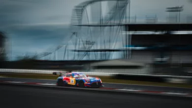 The number 3 Verstappen Racing Mercedes-AMG GT3 Evo panning past the roller coaster during the Nürburgring 24 Hours