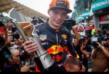 Max Verstappen holds the winner's trophy after the 2017 Malaysian Grand Prix at Sepang