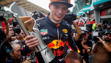 Max Verstappen holds the winner's trophy after the 2017 Malaysian Grand Prix at Sepang