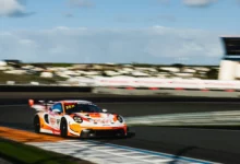The number 93 Ziggo Sport Tempesta Racing Porsche of Eddie Cheever and Peter Dempsey on the kerb at Zandvoort