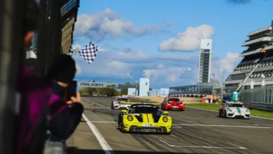 The yellow number 17 Dunlop Motorsport Porsche 911 GT3 R takes the chequered flag to win NLS10 at the Nurburgring