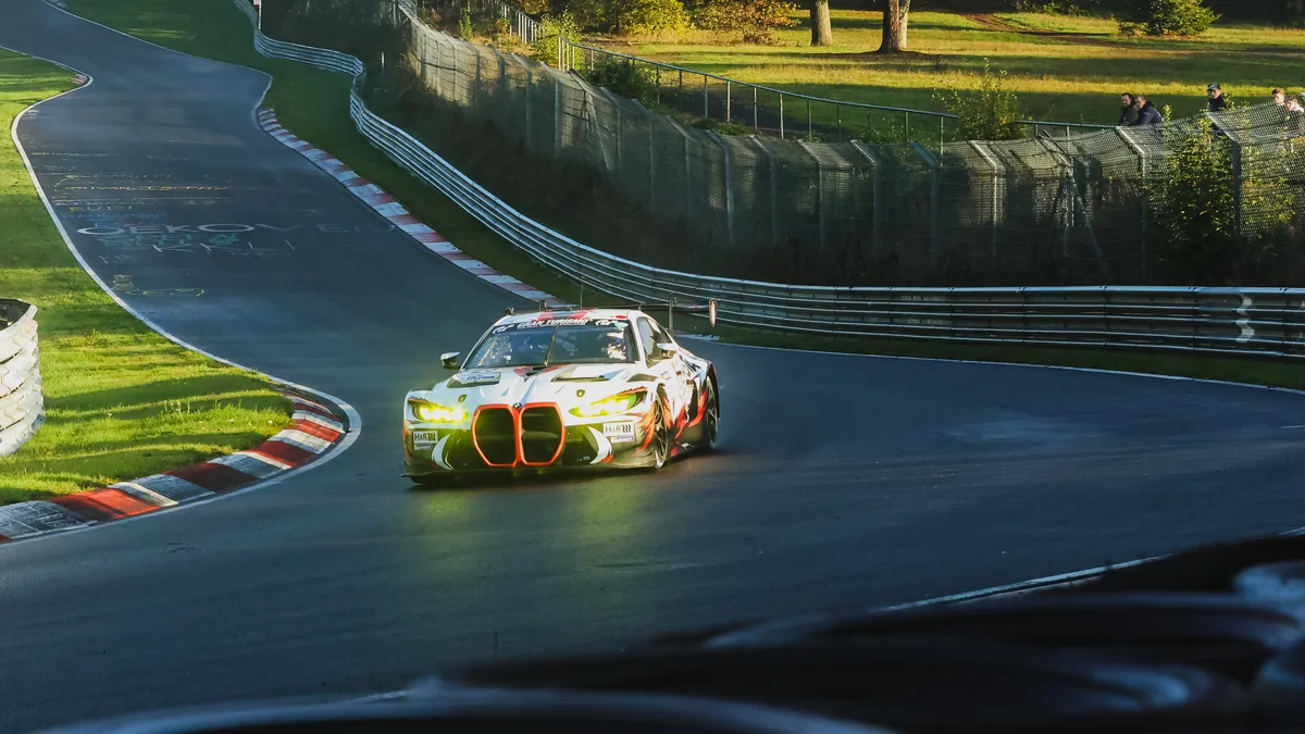 The number 23 Gamota Racing BMW M4 GT3 EVO at Pflanzgarten during NLS10 qualifying at the Nurburgring