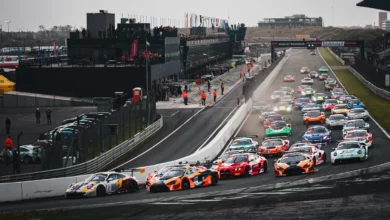 The #2 Boutsen VDS Porsche 911 GT3 R ahead of a McLaren and a BMW into turn 1 at the start of a GT World Challenge race at Zandvoort in September 2026