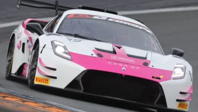 Front view of the pink and white #85 Iron Dames by SP Racing Maserati GT2 cornering at Zandvoort in September 2026