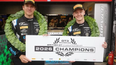 Alex Martin and Jarrod Waberski in Barwell Motorsport overalls holding the 2026 British GT Silver-Am champions board at Brands Hatch