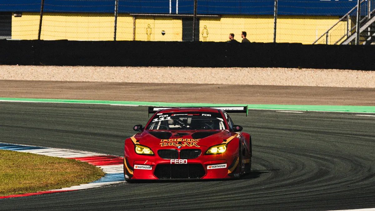 Red BMW M6 GT3 number 111 cornering at TT Circuit Assen