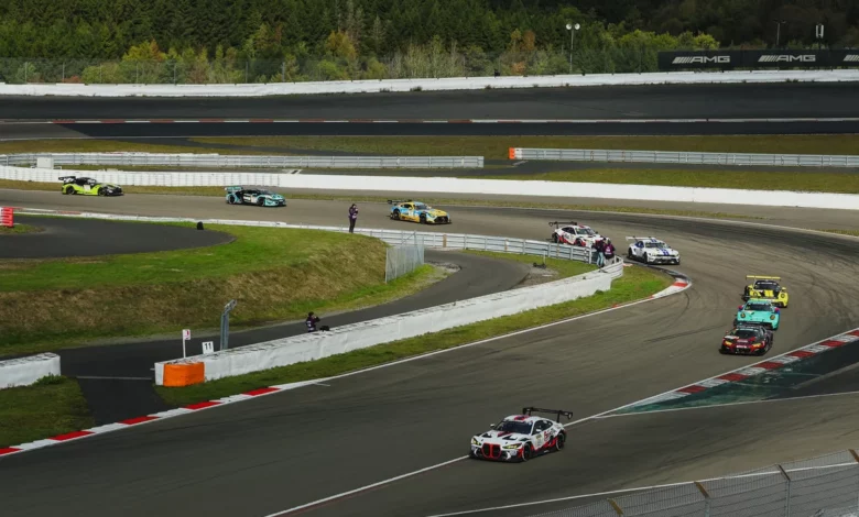 The number 23 Gamota Racing BMW leads a train of GT3 cars through a corner of the Nurburgring GP circuit early in the NLS10 race
