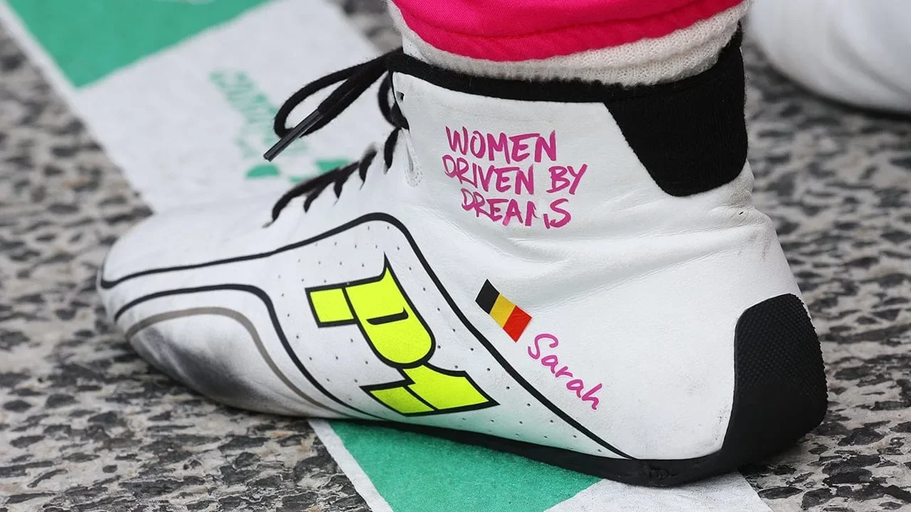 Sarah Bovy's race boot with the Iron Dames motto Women driven by dreams and the Belgian flag at Zandvoort