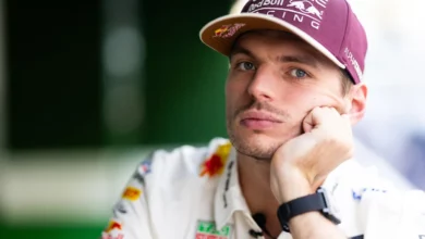 Max Verstappen with his chin on his hand in the Austin paddock