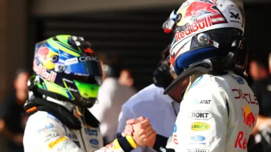 Max Verstappen and Isack Hadjar shake hands in parc ferme after qualifying in Austin