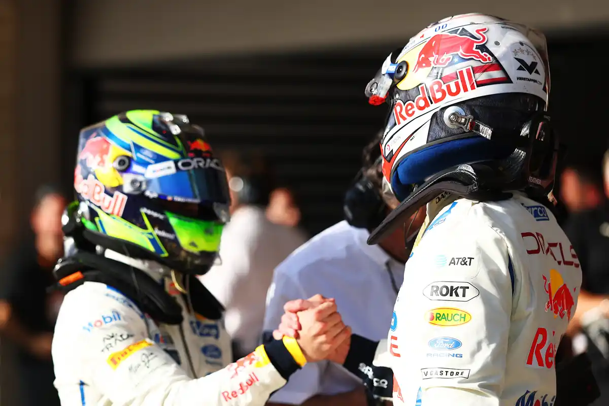 Max Verstappen and Isack Hadjar shake hands in parc fermé after qualifying in Austin