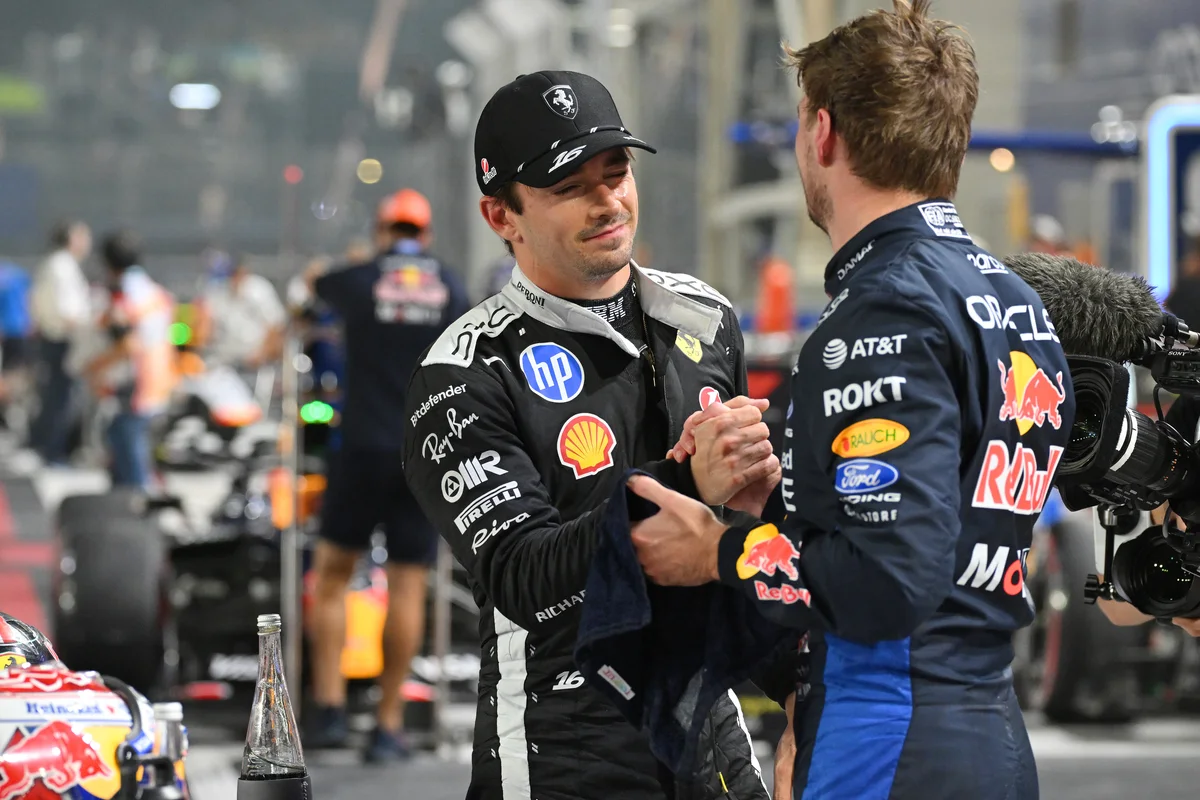 Charles Leclerc and Max Verstappen shake hands in parc ferme after qualifying in Singapore