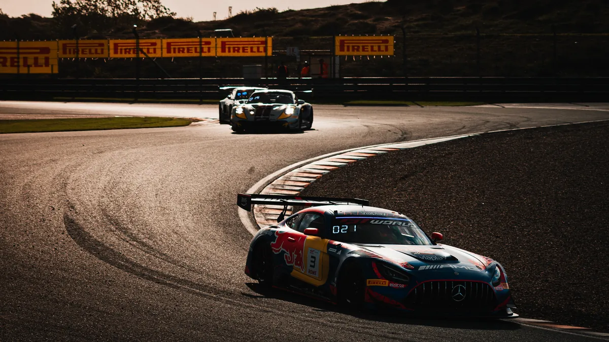 The number 3 Verstappen Racing Mercedes-AMG in Red Bull colours leading two cars through a corner at Zandvoort