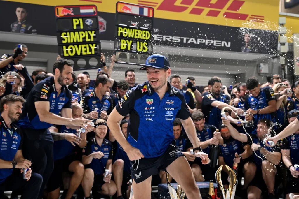 Max Verstappen celebrates with the Red Bull Racing team after winning the Singapore Grand Prix