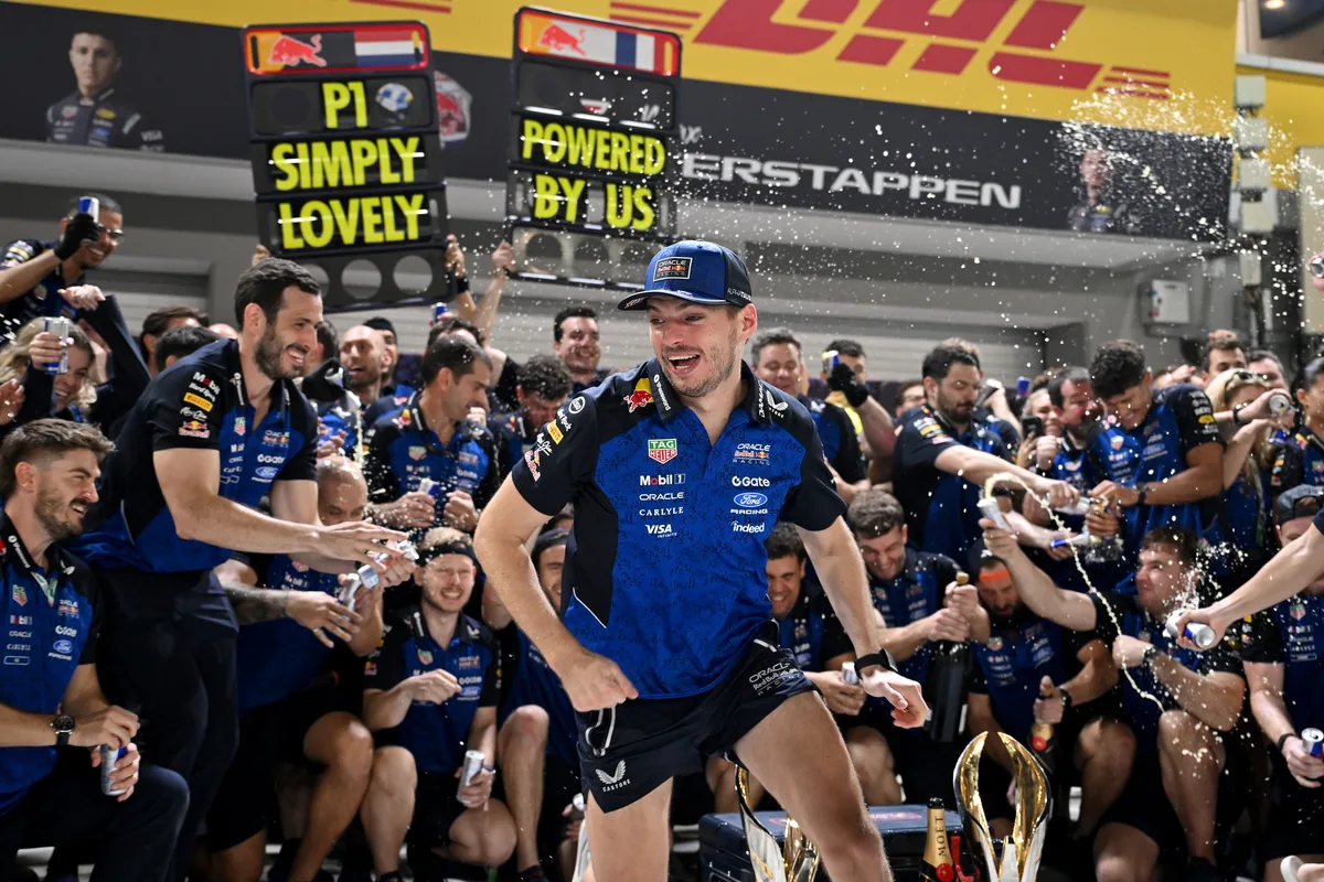 Max Verstappen celebrates with the Red Bull Racing team after winning the Singapore Grand Prix
