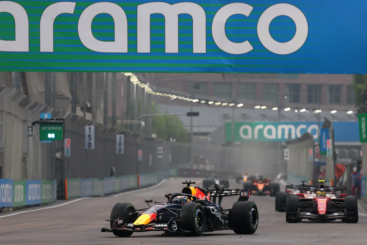 Max Verstappen in the Red Bull RB22 ahead of a Ferrari during the Singapore Sprint 2026