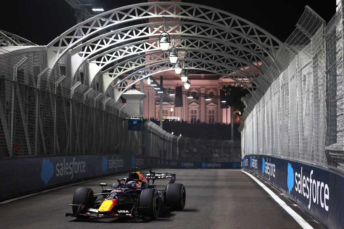 Max Verstappen in the Red Bull RB22 under the lights at Marina Bay during Sprint Qualifying for the 2026 Singapore Grand Prix