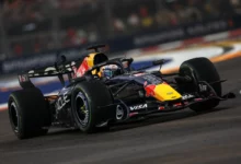 Max Verstappen in the Red Bull RB22 on track during the Sprint at Marina Bay Street Circuit, Singapore 2026