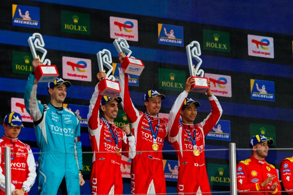 Toyota drivers lift their trophies on the Barcelona podium