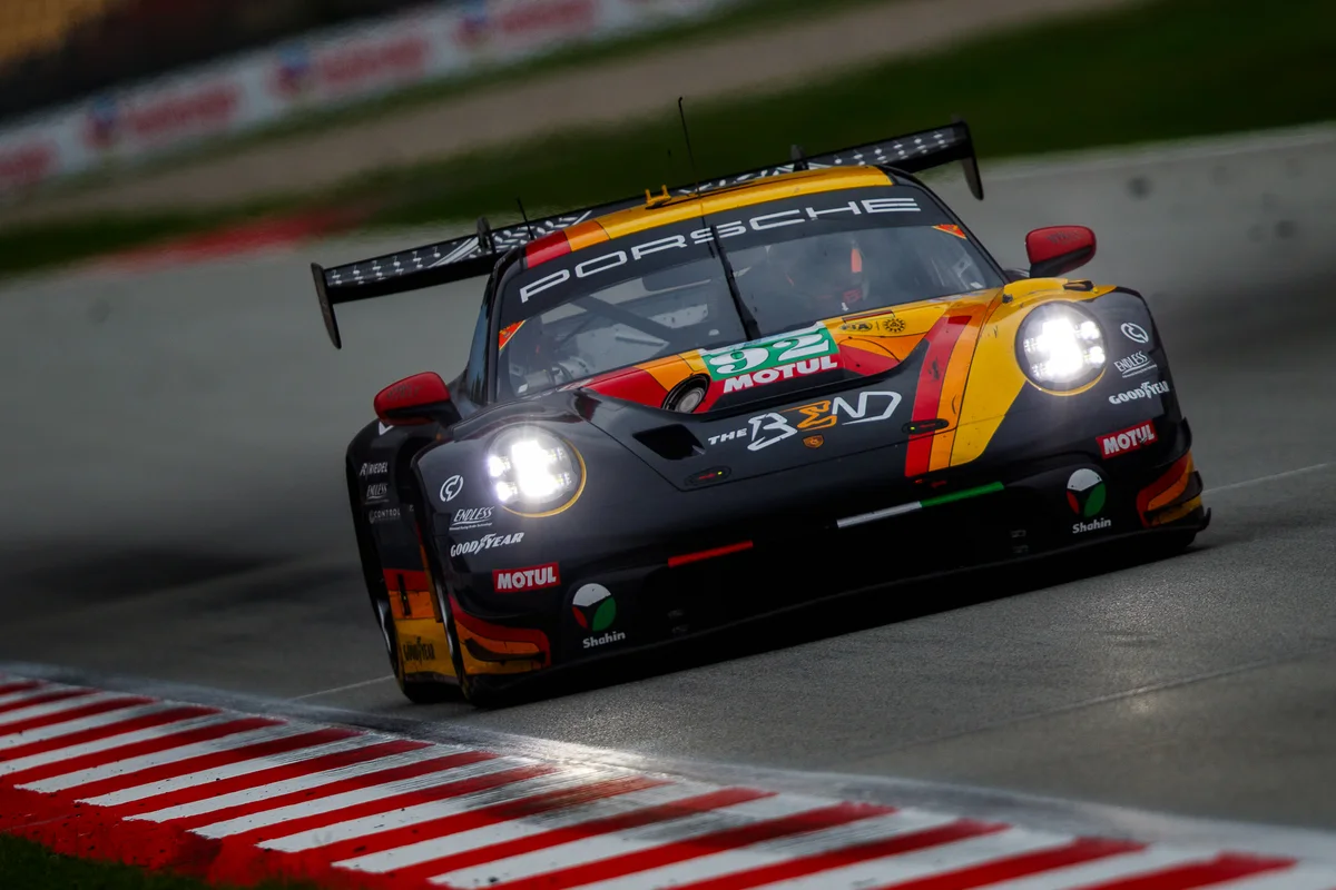 The black, orange and yellow #92 The Bend Manthey Porsche 911 GT3 R on track in Barcelona